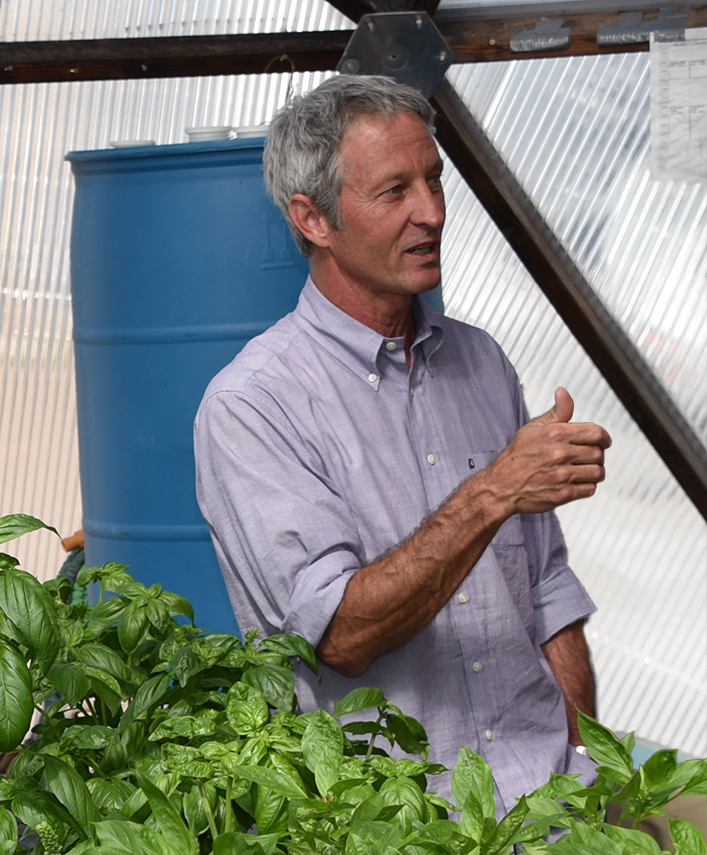 Luke Spangenburg giving a tour in the SFCC greenhouse in 2015