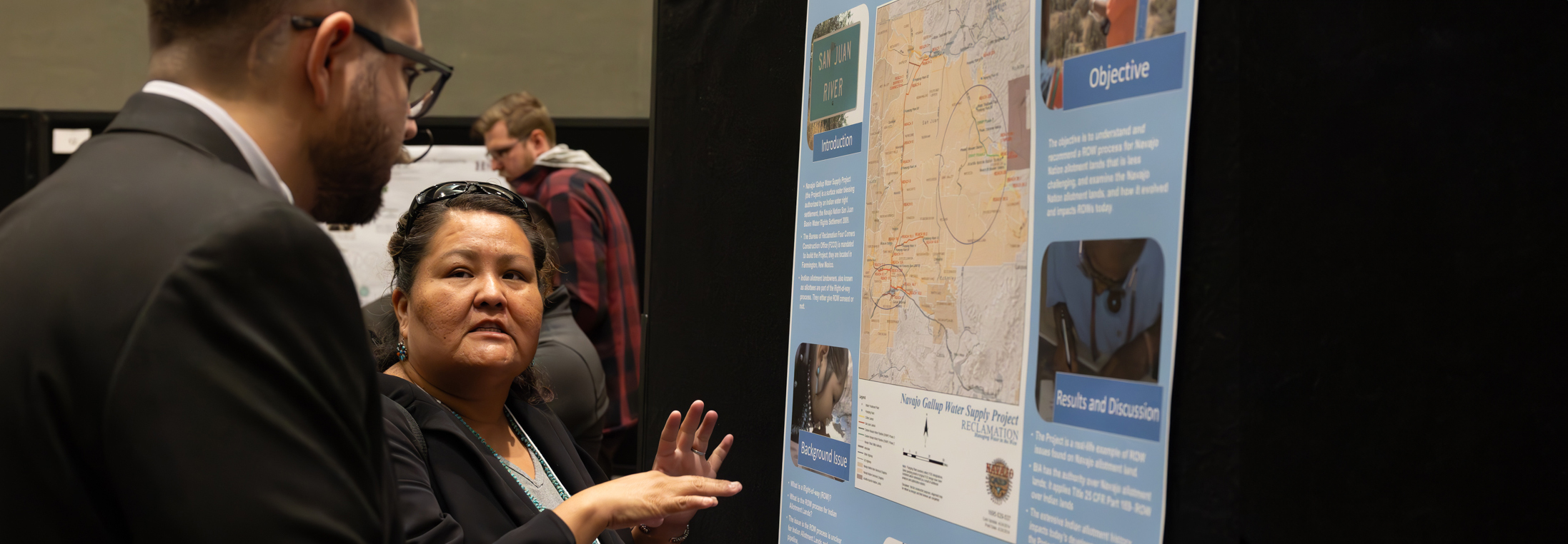 woman scientist sharing her research. Photo credit: Bret Latter