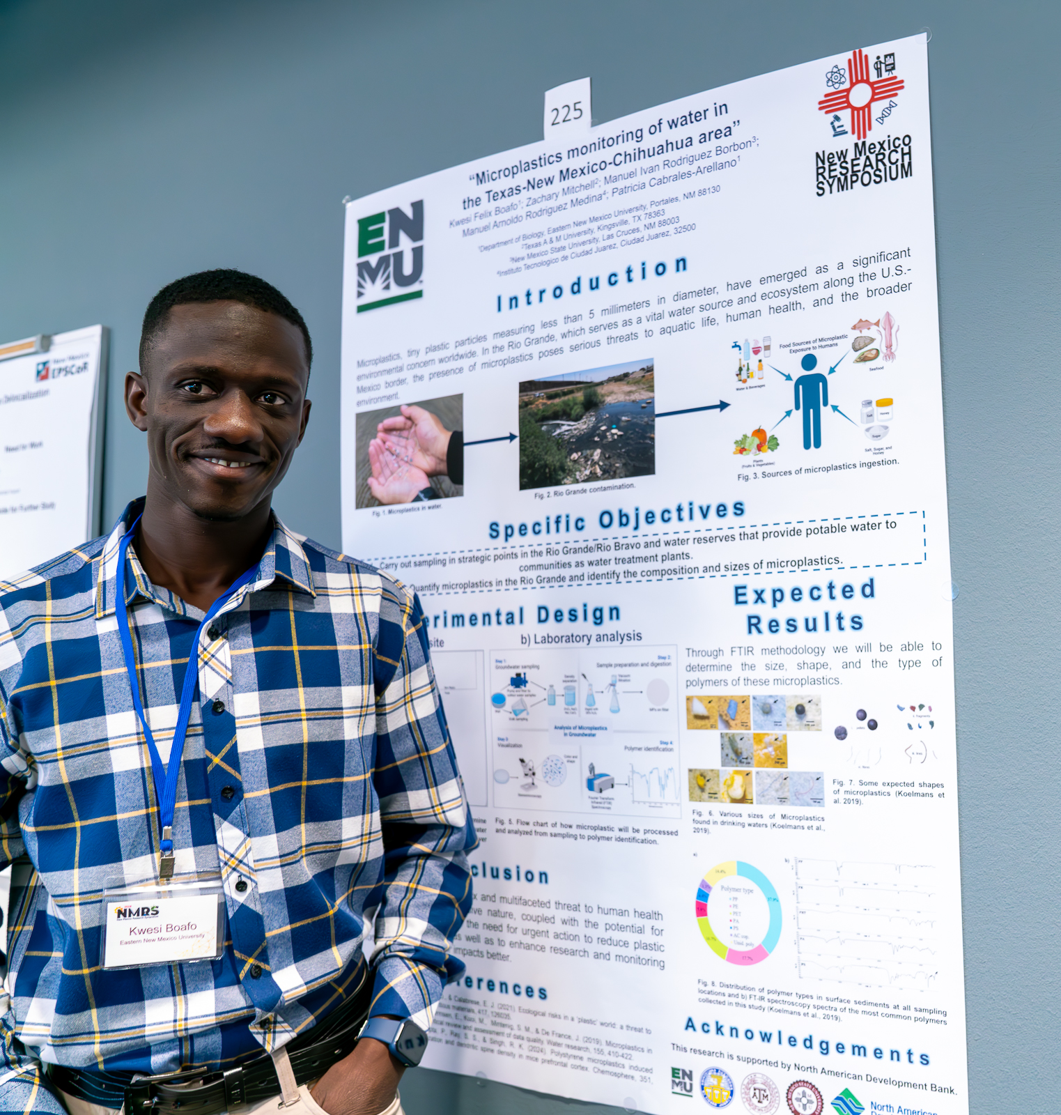 man standing in front of research poster